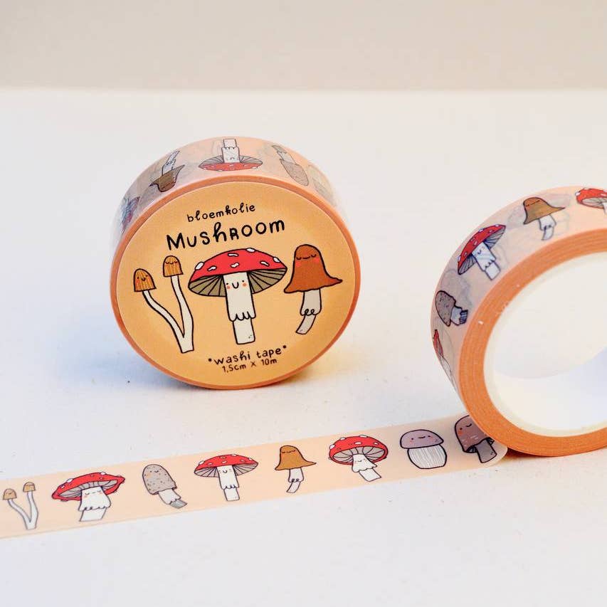 Image of washi tape with tan background and images of mushrooms in red, white, brown. 