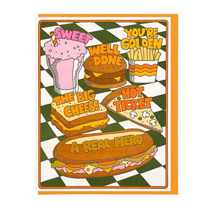 Greeting card with green and white checkerboard background with soda says, "sweet", hamburger says, "Well done", french fries say, "You're golden", grill cheese sandwich says, "the big cheese", pizza says, "hot ticket", sub sandwich says, "a real hero". Gold envelope included. 