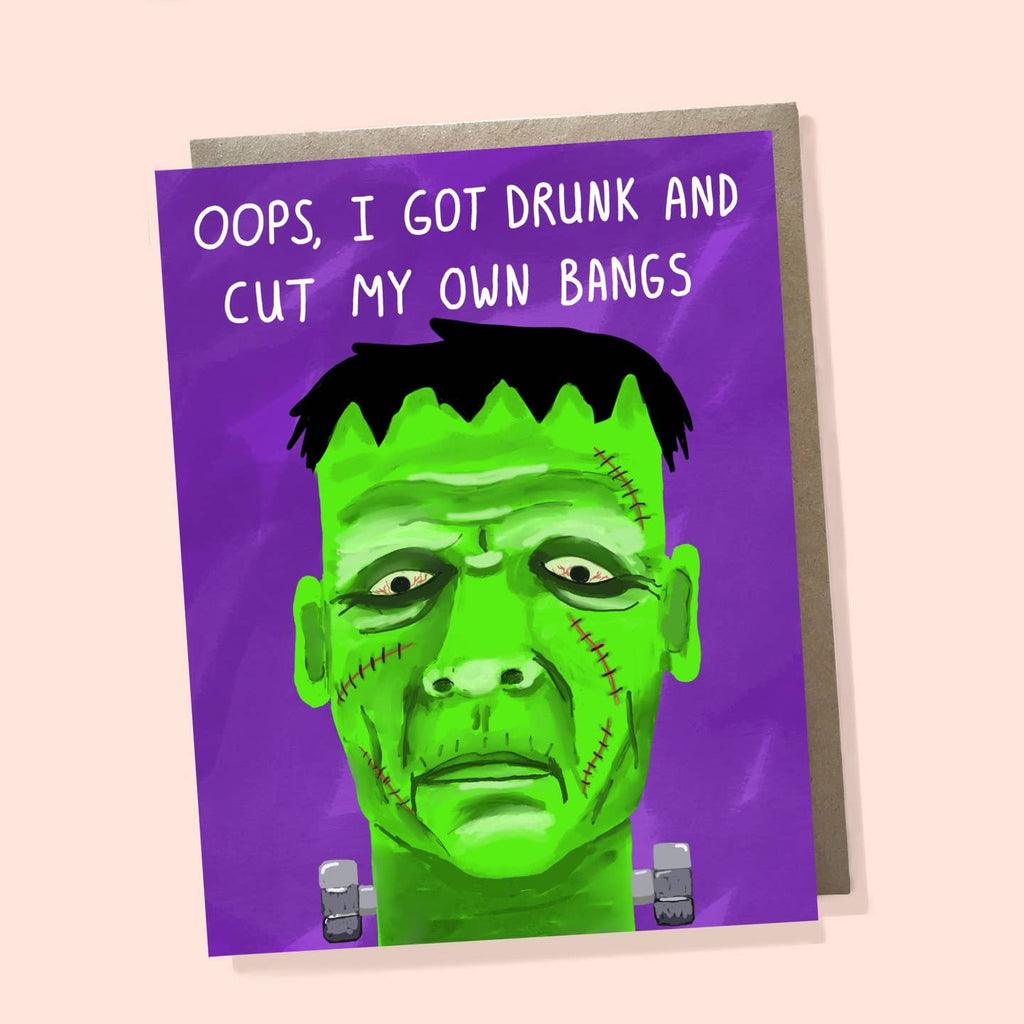 Greeting card with purple background with image of Frankenstein with green face and black hair. White text says, "Oops, I got drunk and cut my own bangs". Envelope included. 