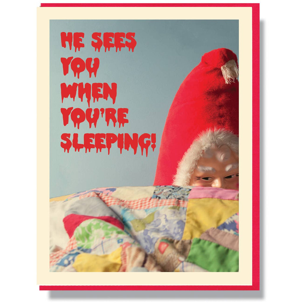 Image of Creepy Santa peering over a bed with red text that looks like dripping blood. Red envelope included.