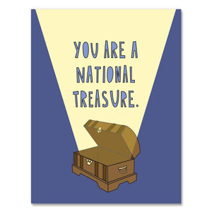 Greetind card with blue and yellow background and image of a brown treasure chest with blue text says, "You are a national treasure." Envelope included. 