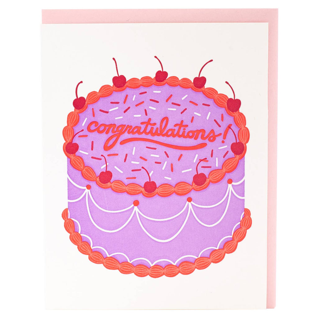 Image of greeting card with white background and image of a pink and red cake with red text says, "Congratulations!". Pink envelope included. 