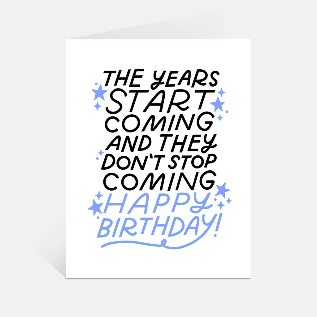 Greeting card with white background and black and blue text says, "The years start coming and they don't stop coming Happy Birthday!". Envelope included. 