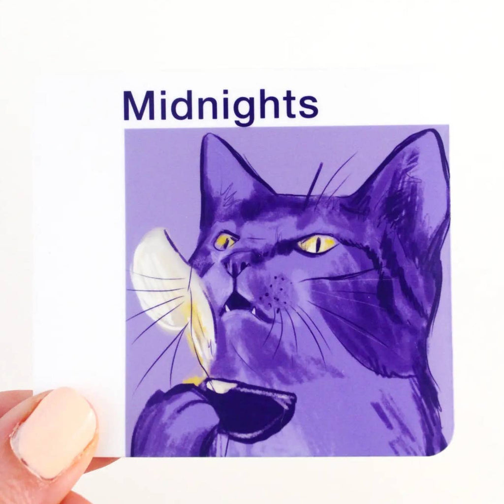 Image of sticker with white background and image of a purple cat  with yellow eyes and purple text says, "Midnight". 