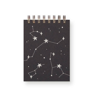 Notebook cover with black background and silver constellation designs.