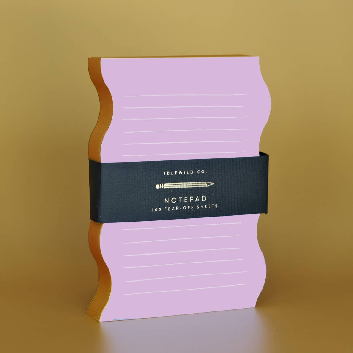 Notepad with pink background and wavy orange edging,