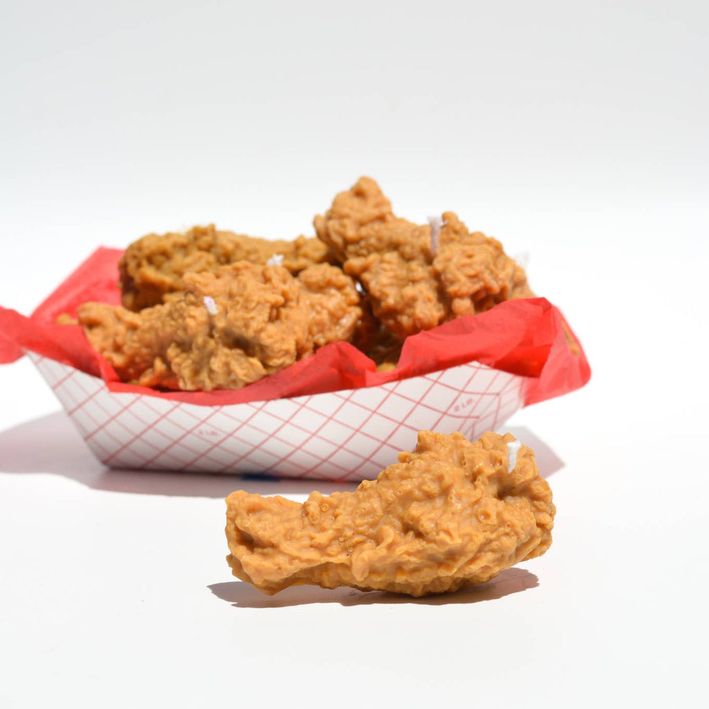 Image of a basket of fried chicken wing candles. 