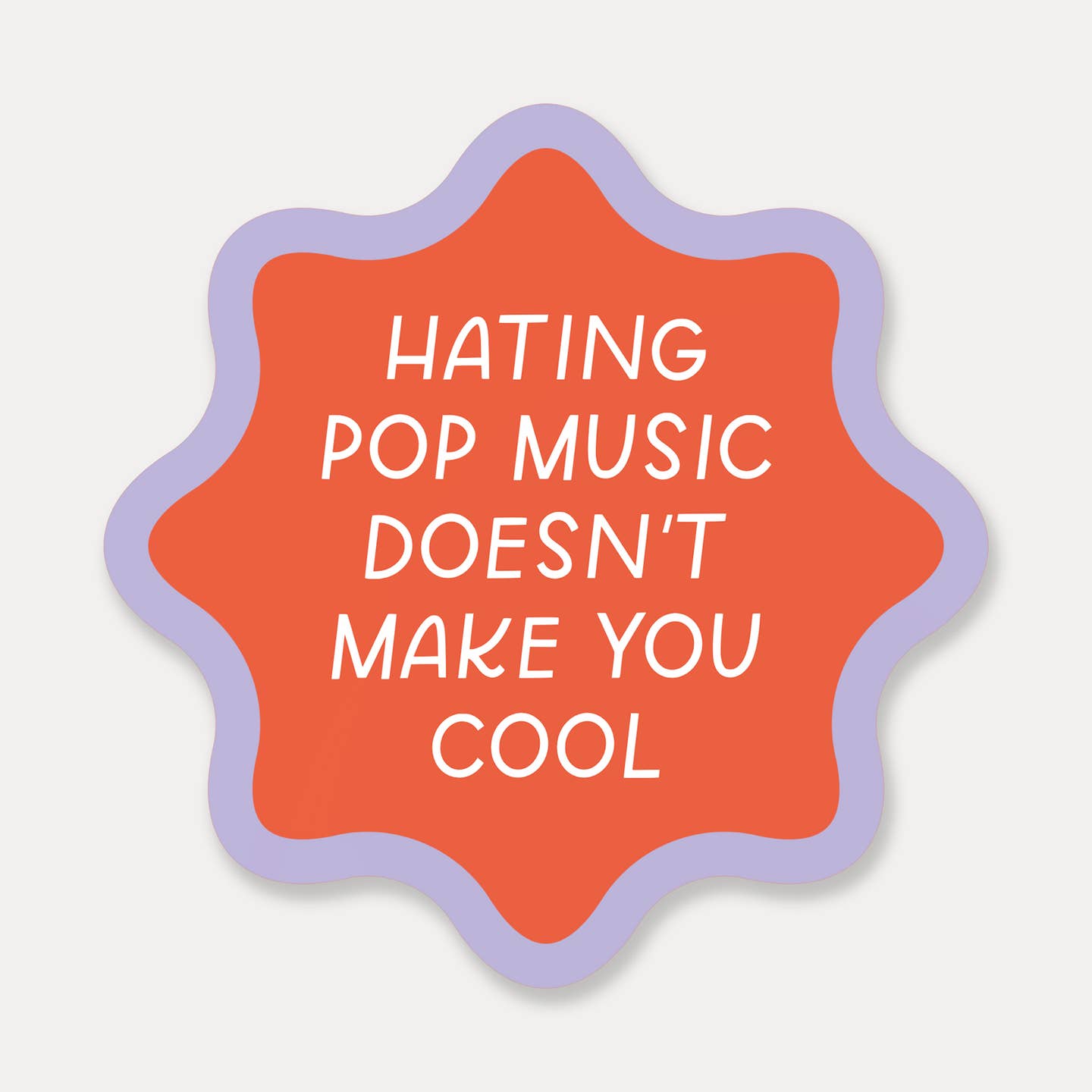 Decorative sticker with red background and lilac border with white text says, "Hating pop music doesn't make you cool". 