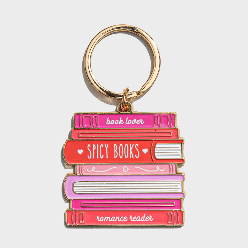 Image of a stack of books in red, pink and white with white text on book bindings says, "book lover, spicy books, romance reader" and gold ring for keys.