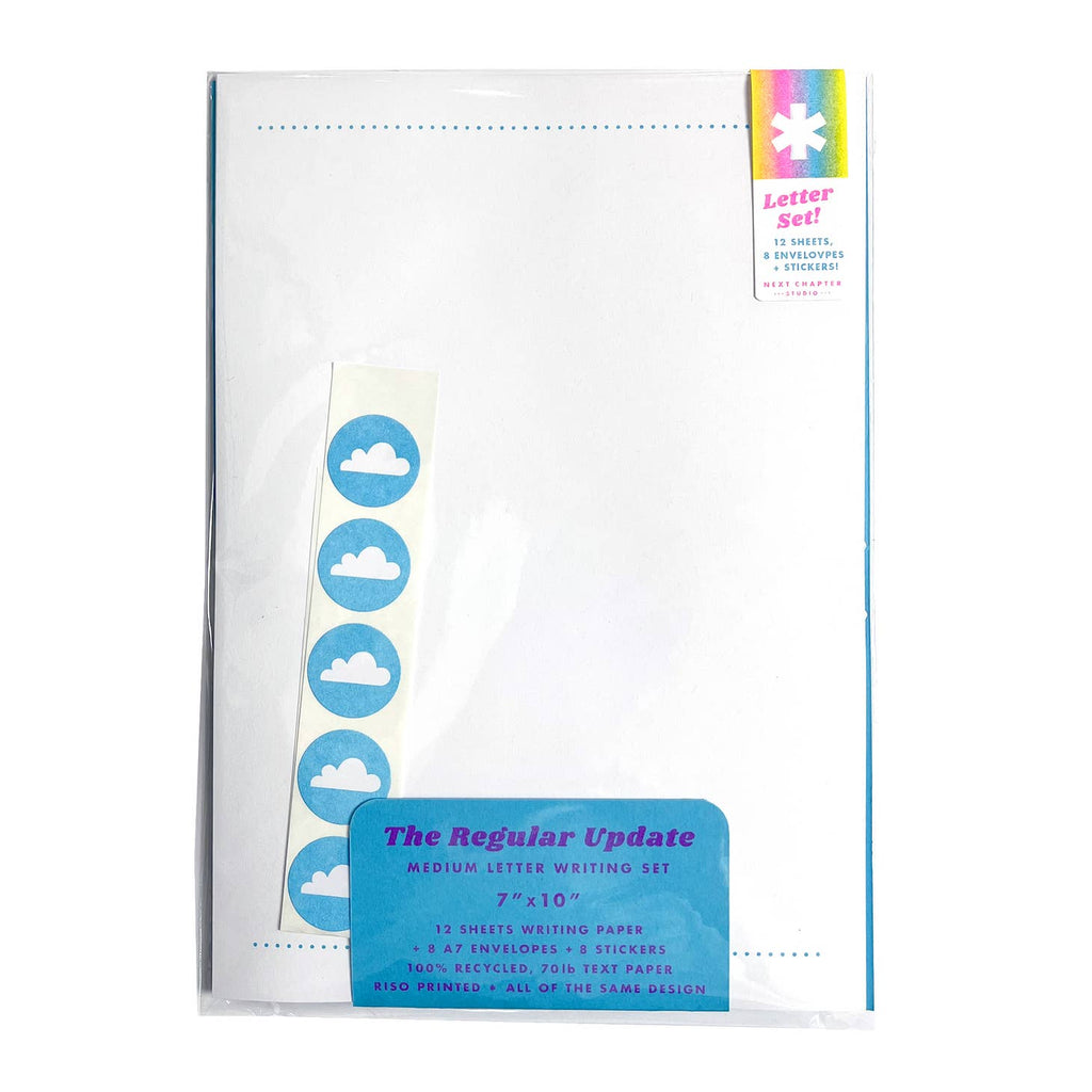 White paper with line of  aqua dots at top and aqua background stickers with white clouds. 