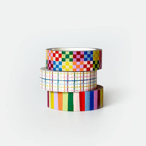 Stack of three washi tapes, rainbow colors in checkerboard, plaid and striped. 