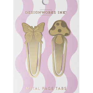 Brass page tabs in the shape of a butterfly on top of clip and mushroom on tip of clip. 