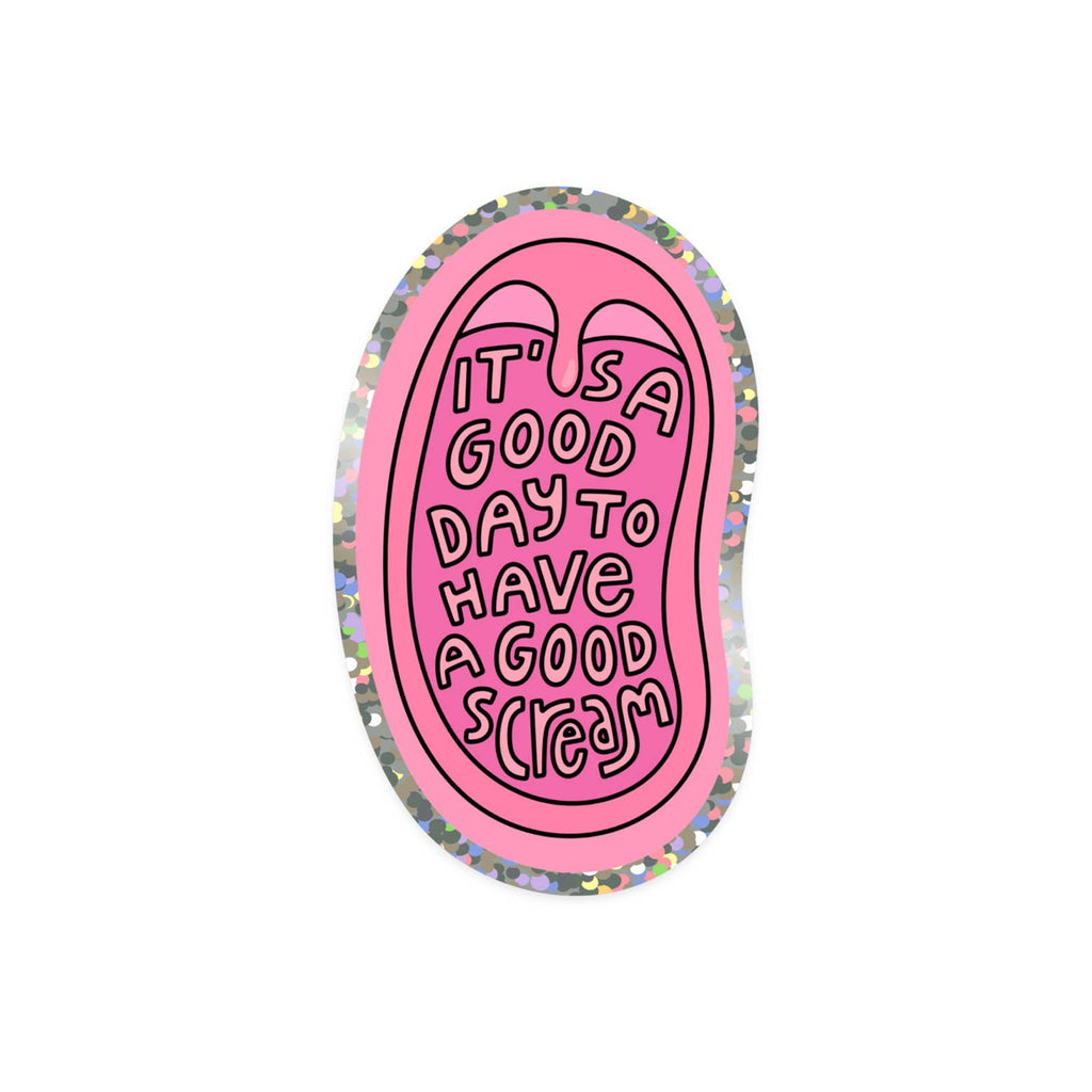 Sticker with image of open mouth in shades of pink with holographic border with light pink text says, "It's a good day to have a good scream". 