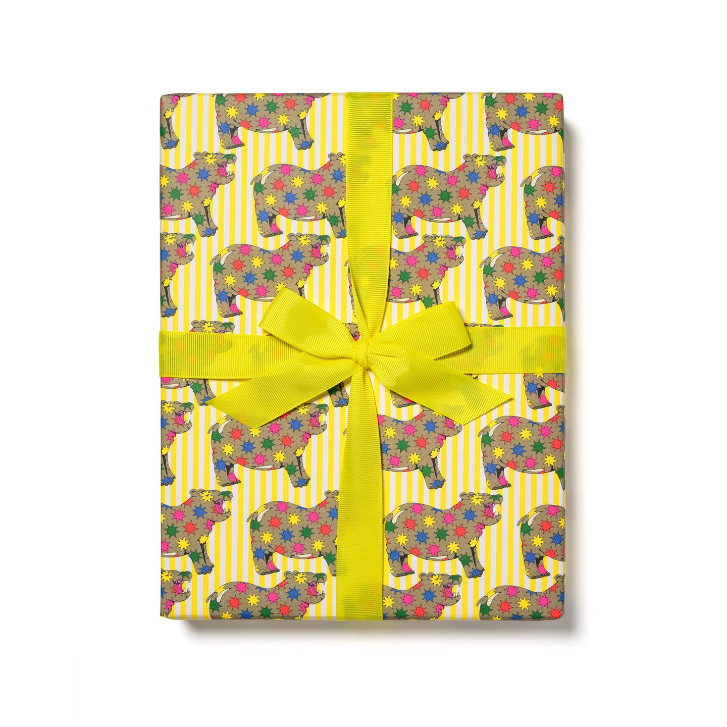 Gift wrap with yellow and white stripe background and images of brown hippo covered in rainbow color star bursts. 