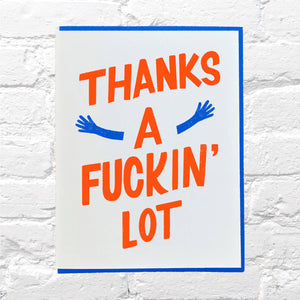 White background with red text says, "Thanks a fuckin" lot" with blue outstretched arms. Blue envelope is included. 