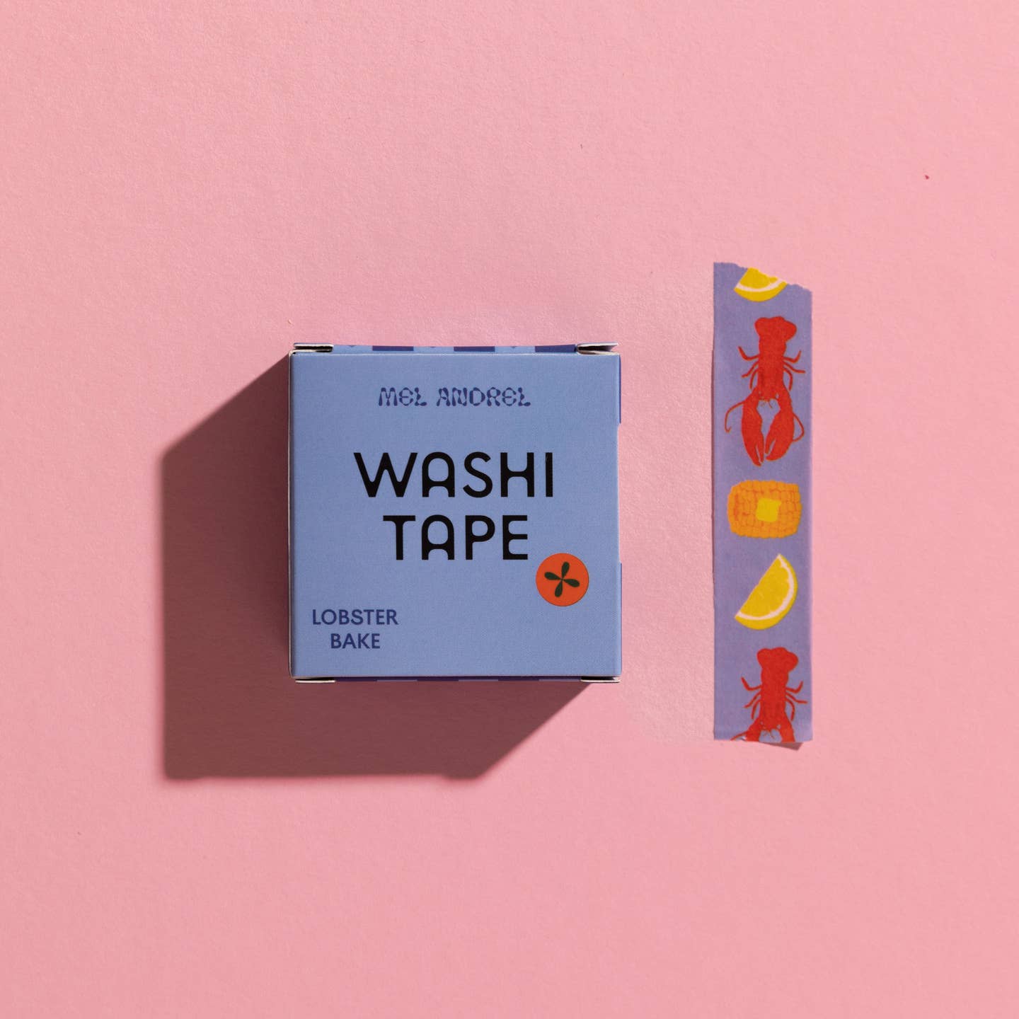 Decorative tape with blue background and images of lobster, corn and lemon wedge.