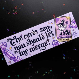 Decorative sticker with lavender background and black text says, "The cards say you should let me merge!" with image of a tarot card with the fool on it. 