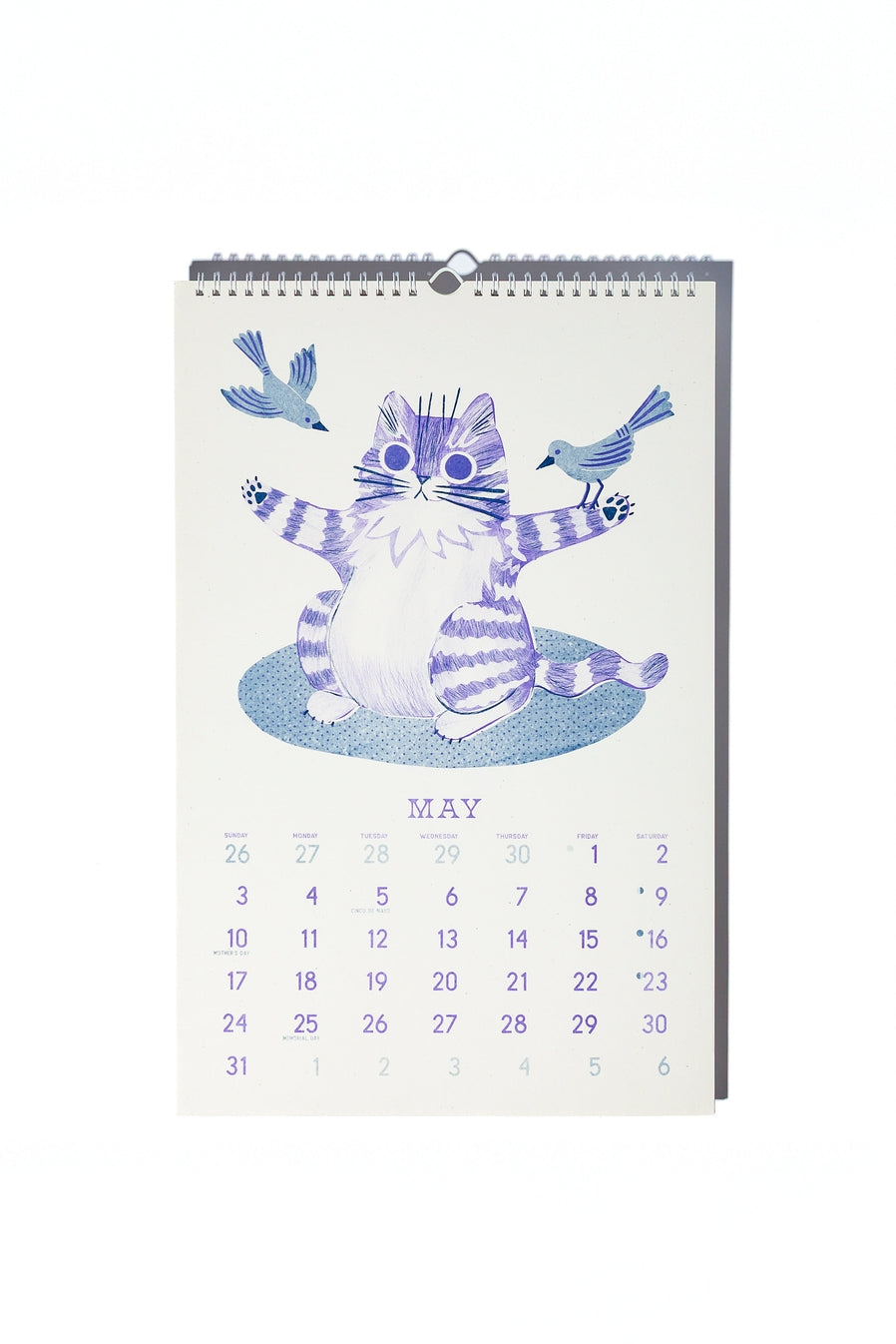 May calendar page with image of a purple and white striped cat holding out it's front arms and blue birds are landing on his arms.