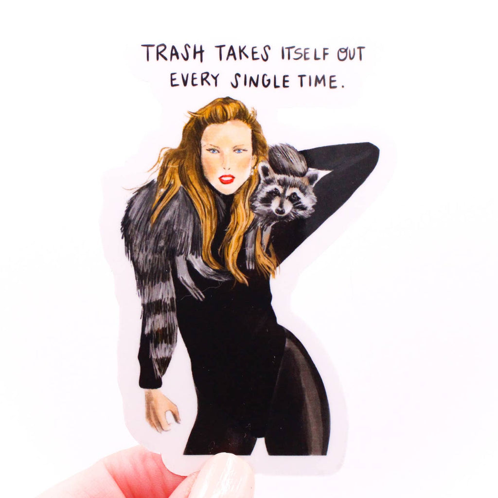 Image of sticker of Taylor Swift in a black leotard with a raccoon around her neck and black text says, "Trash takes itself out every single time.". 