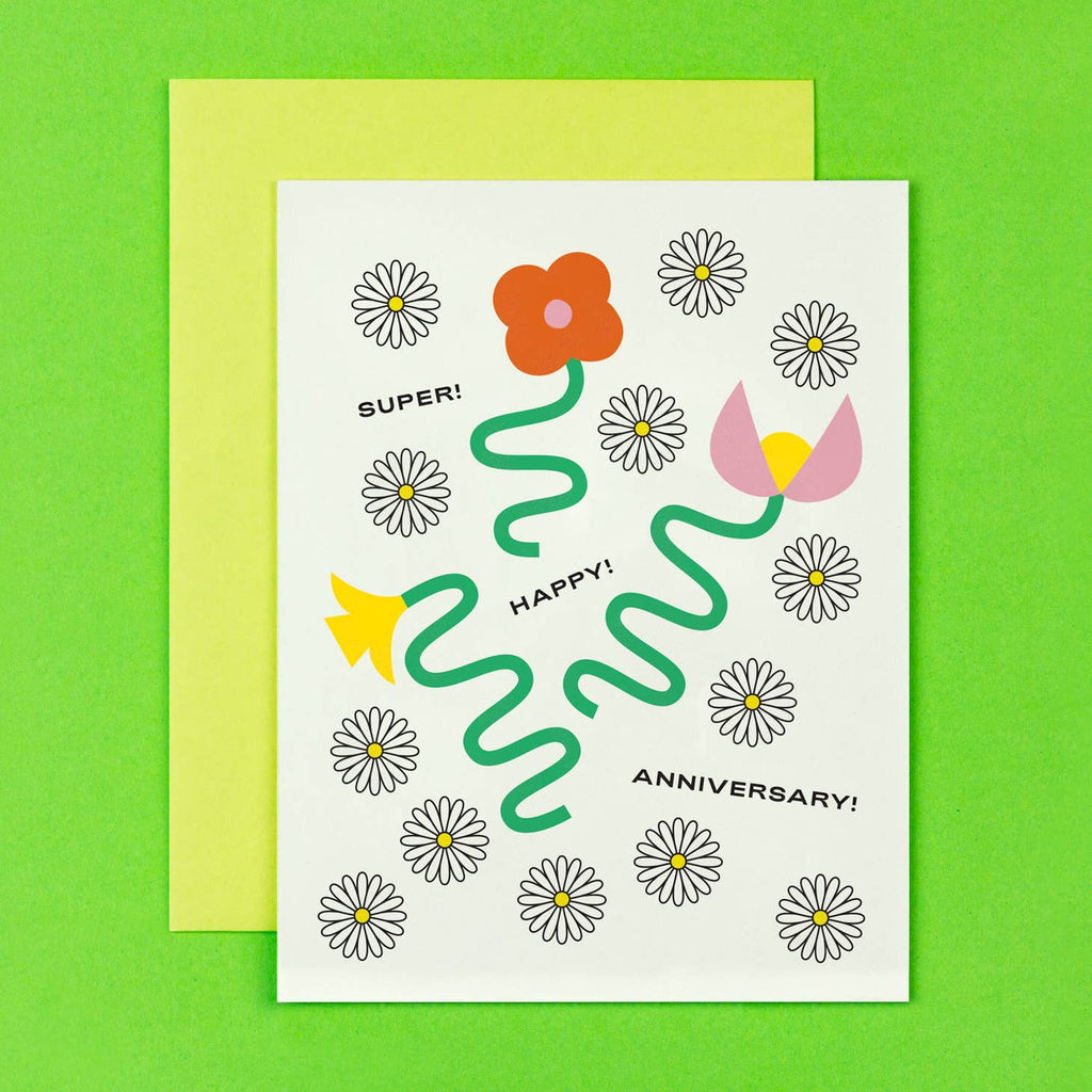 White background with image of squiggly stemmed flowers and yellow and white daisies. Black text says, "Super! Happy! Aniversary!". Yellow envelope included. 