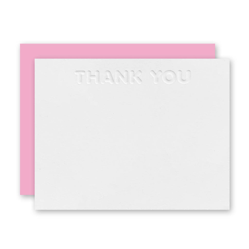 White card with embossed "thank you" at top center of card. Pink envelope included. 