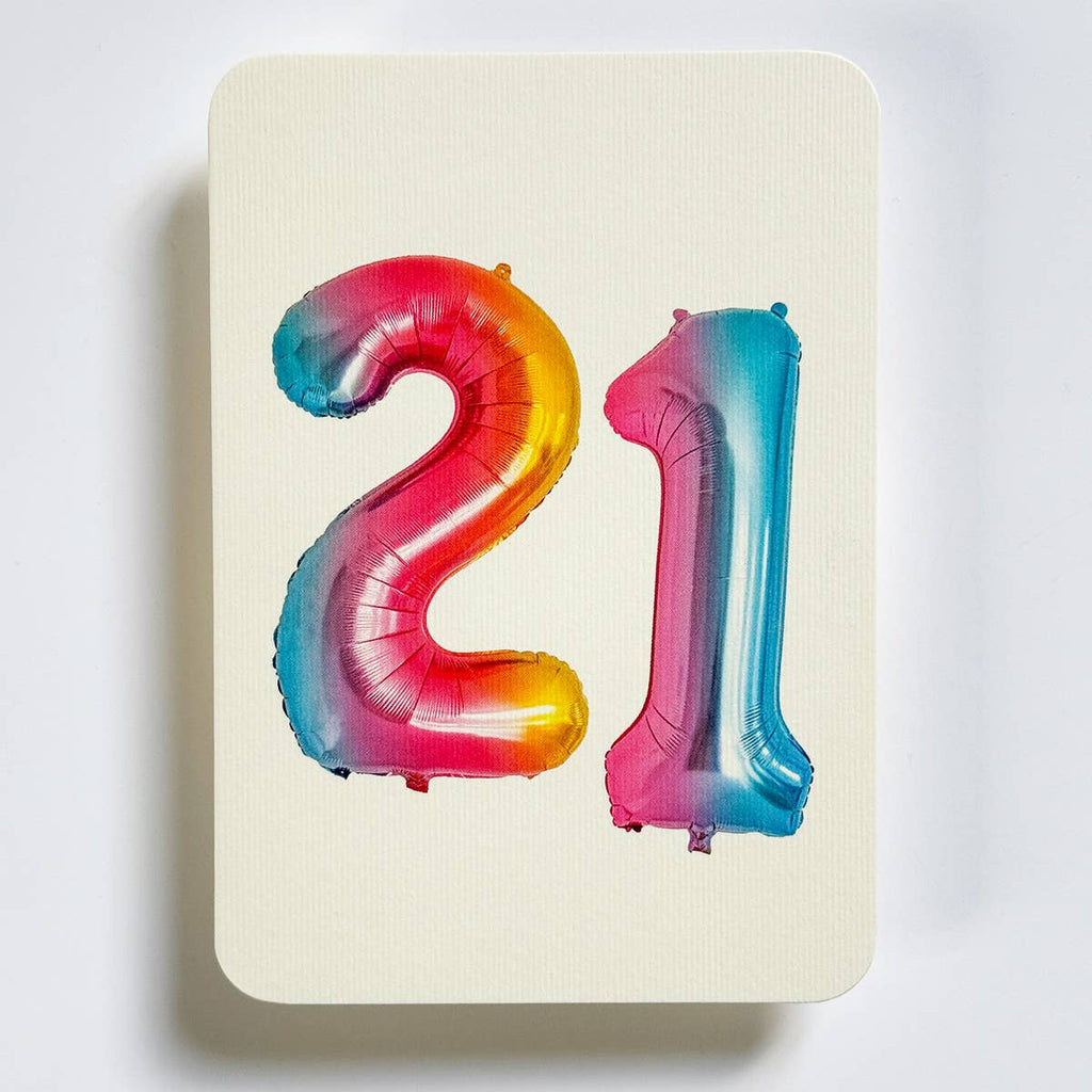 Greeting card with cream background and image of iridescent balloons in "21". Envelope included.
