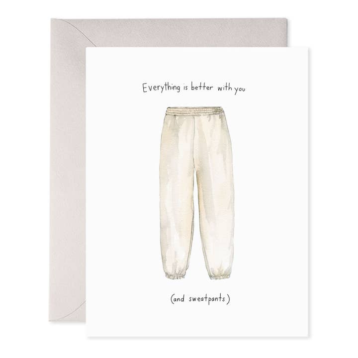 Greeting card with white background and image of a pair of sweatpants with black text says, "Everythingis better with you (and sweatpants)". Grey envelope included.