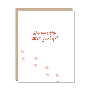 Greeting card with white background and rust text says, "She was the best good girl." with image of paw prints.  Kraft envelope included. 