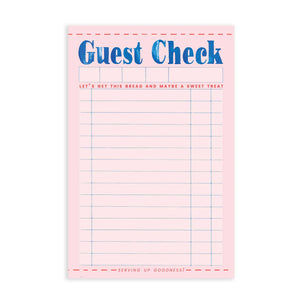 Notepad with pink background and image of a guest check with lines and boxes for order. Blue text as top says, "Guest Check" and red text says, "Let's get this bread and maybe a sweet treat" and "serving up goodness!" at the bottom. 