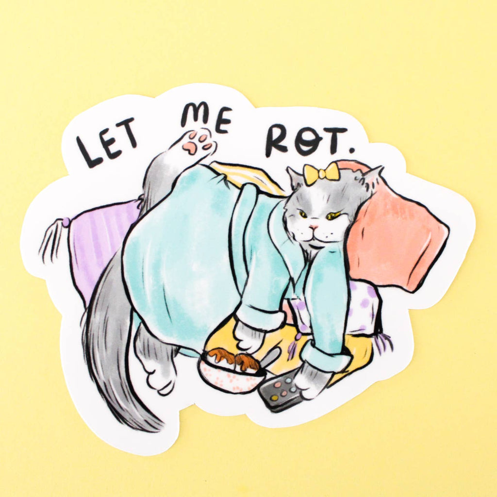 Decorative sticker with image of a grey cat laying on a pill with remote control and snack wearing a bathrobe with black text says, "Let me rot.".