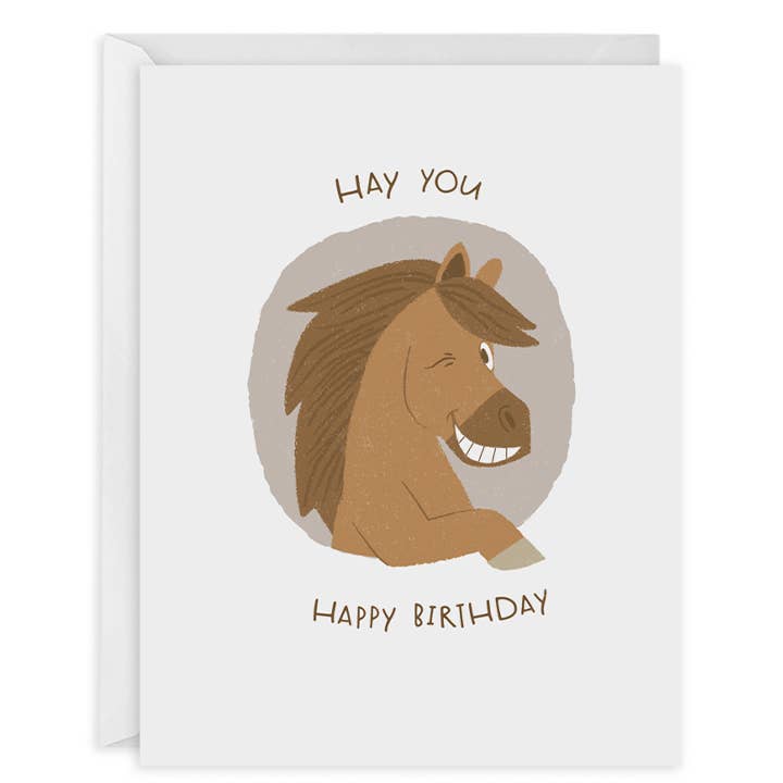 Greeting card with white background and image of brown horse winking and smiling with brown text says, "Hay you, Happy Birthday". White envelope included. 