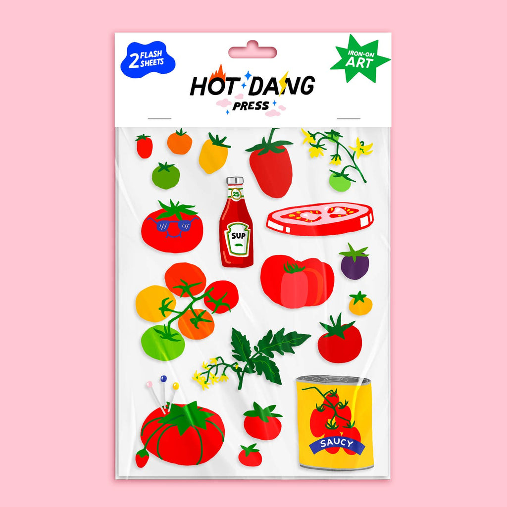 Image of a sheet of iron on transfers with tomatoes, ketchup, can of tomatoes and tomato pin cushion.