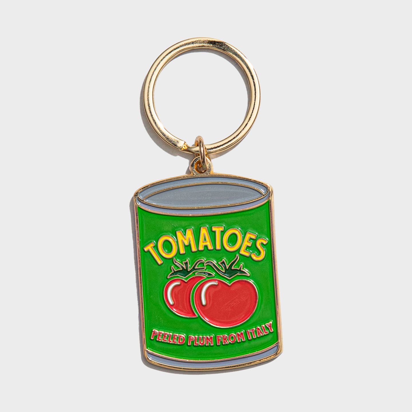 Image of a can of tomatoes with green background and yellow text says, "Tomatoes" with image of red tomatoes. Gold ring for keys. 