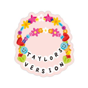 Image of sticker with pink background with image of two friendship bracelets including white beads that with black text says, “Taylors version”.     