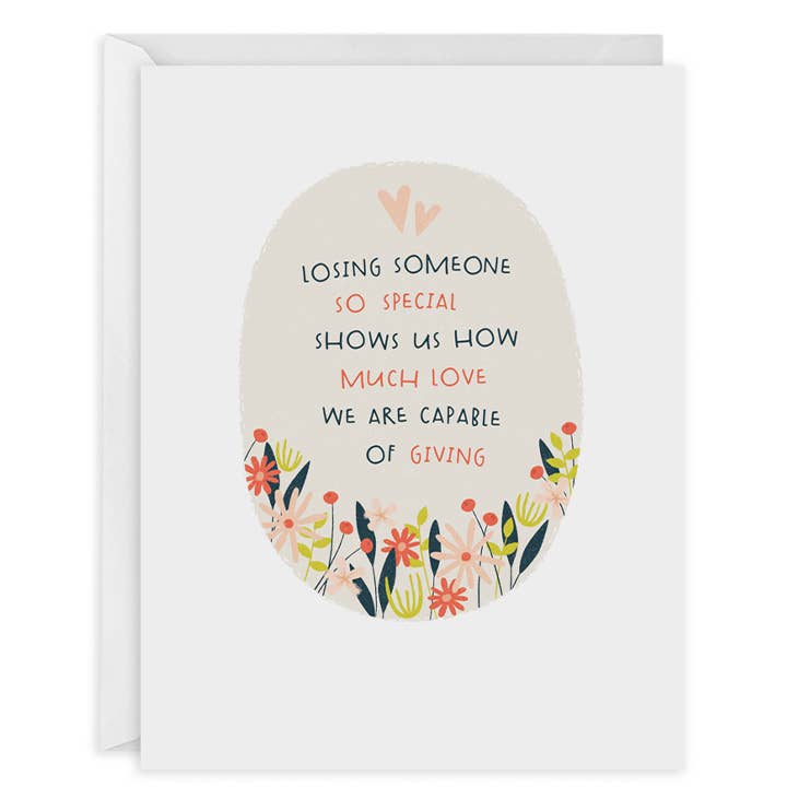 Greeting card with white background and cream oval at center of card with images of flowers at bottom of oval and black and pink text says, "Losing someone so special show us how much love we are capable of giving". White envelope included. 