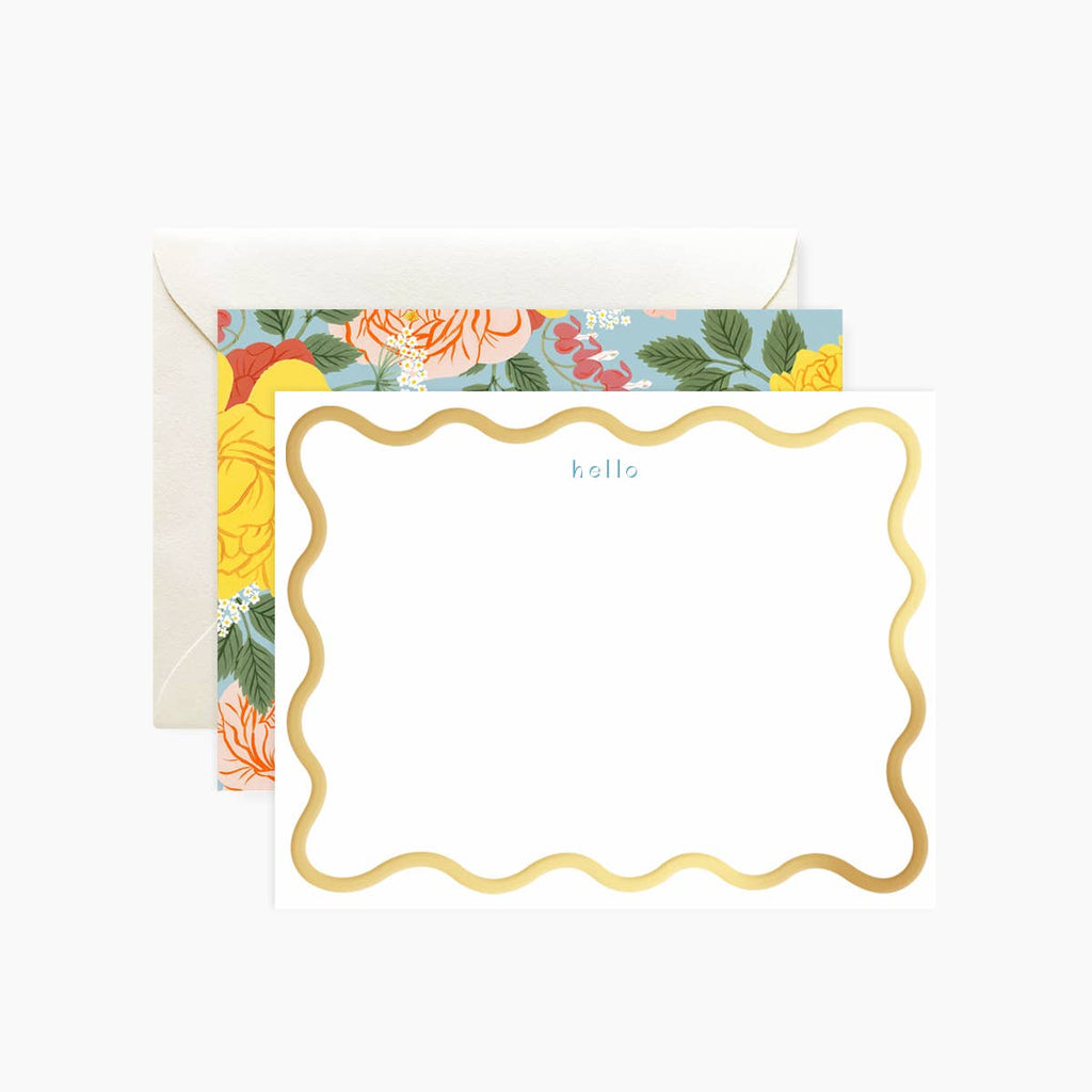 White background with gold foil wavy border. Blue text says, “hello”. Reverse side of card has blue background with pink, yellow and red flowers with green leaves and stems. White envelopes included.    