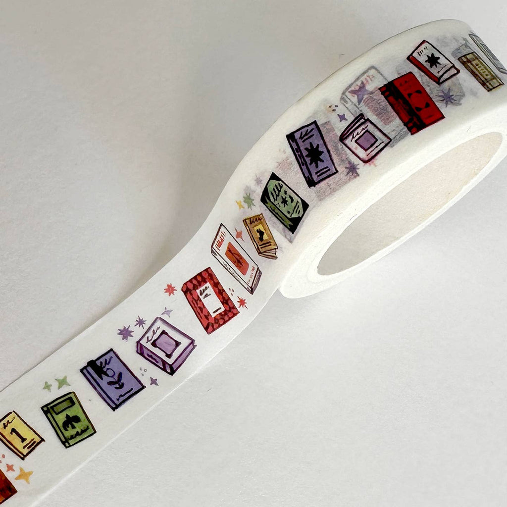 Image of washi tape with white background and images of books in rainbow colors with same color stars. 