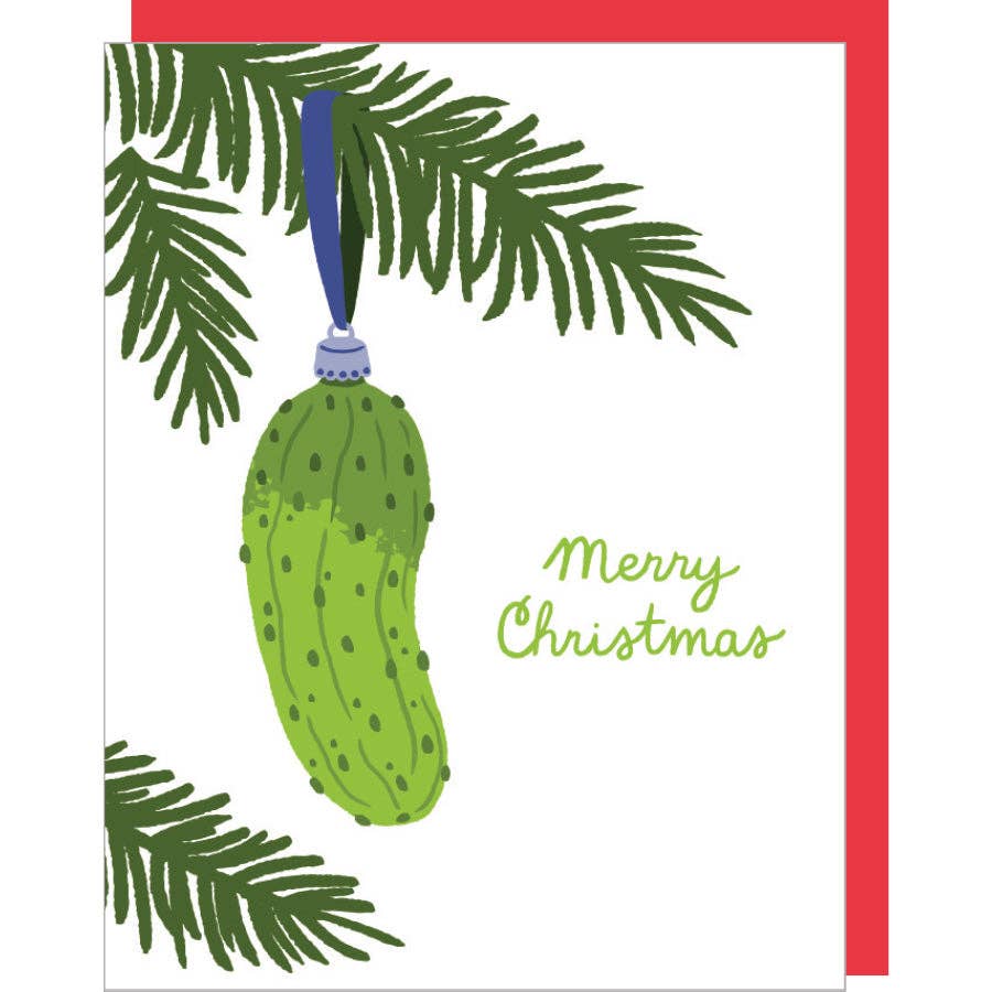 Greeting card with white background and image of pine tree limb with a green pickle ornament hanging on it. Green text says, "Merry Christmas". Red envelope included. 