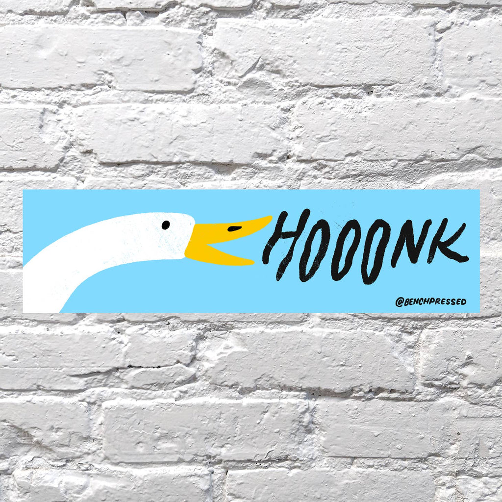 Image of bumper sticker with blue background and head of white goose with yellow beak and black text says, "Hooonk".