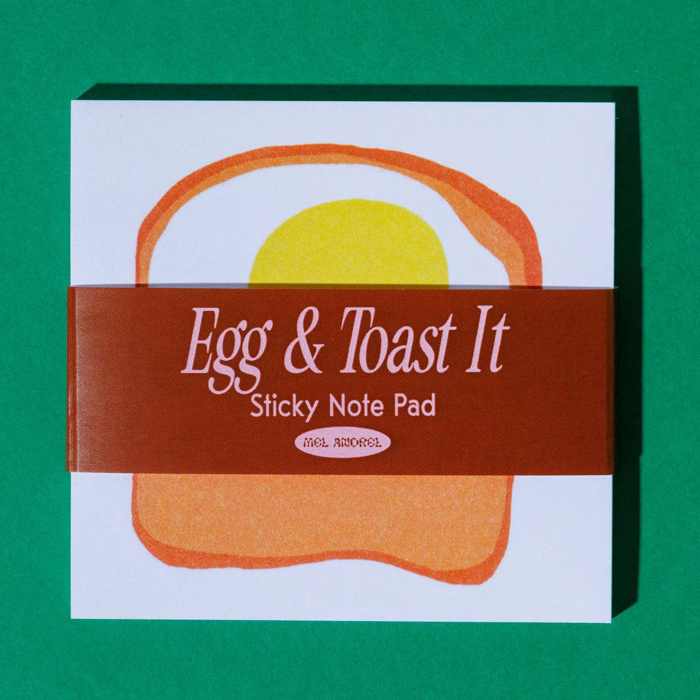 Sticky notepad with white backgrund and image of a fried egg on toast in center.