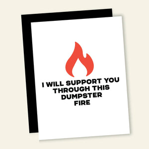 Greeting card with white background with black text says, "I will support you through this dumpster fire" and image of a red flame. Black envelope included. 