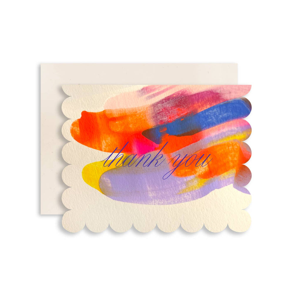 Ivory background card with scalloped edges with swipes of color in lilac, pink, blue, orange and magenta. Gold foil text says, "Thank you". Ivory envelope included,. 
