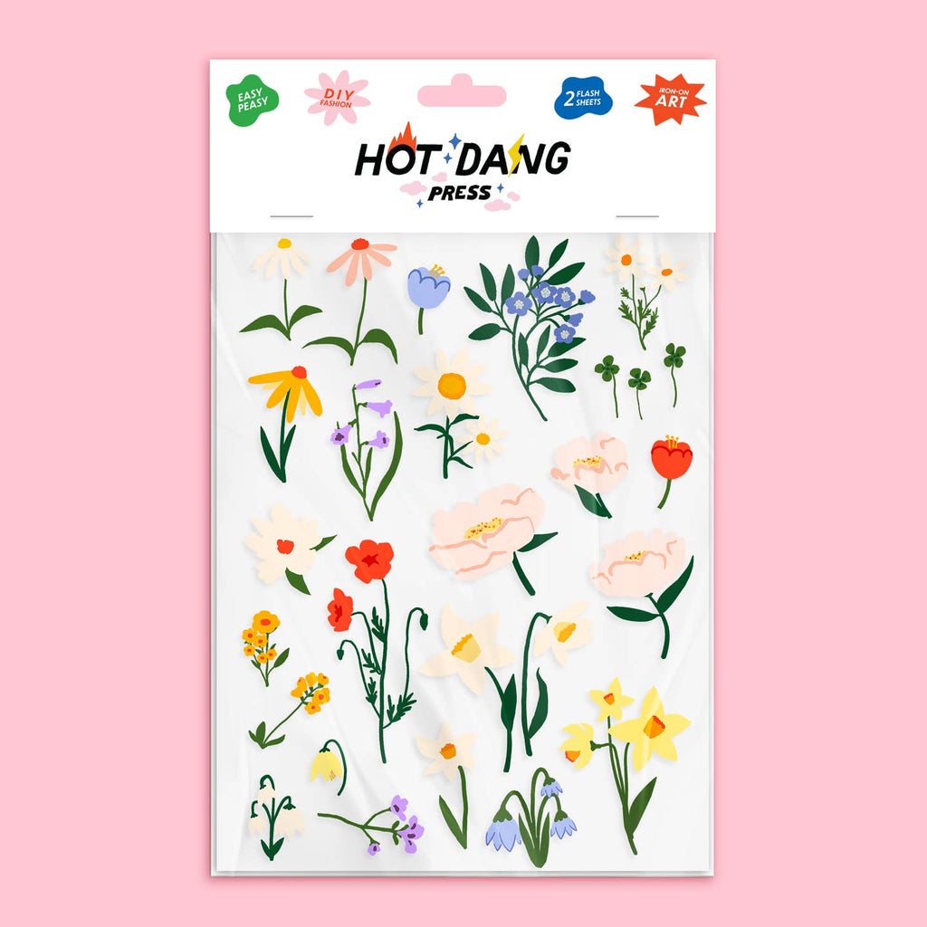 Image of iron on appliques with blue, yellow, red and pink flowers with green stems. 