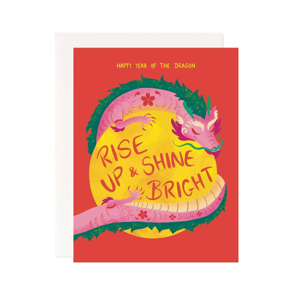 Red background with image of pink and green dragon hugging a yellow moon with yellow text says, “Happy year of the dragon” and red text on the moon says, “Rise up & shine bright”. White envelope included.          
