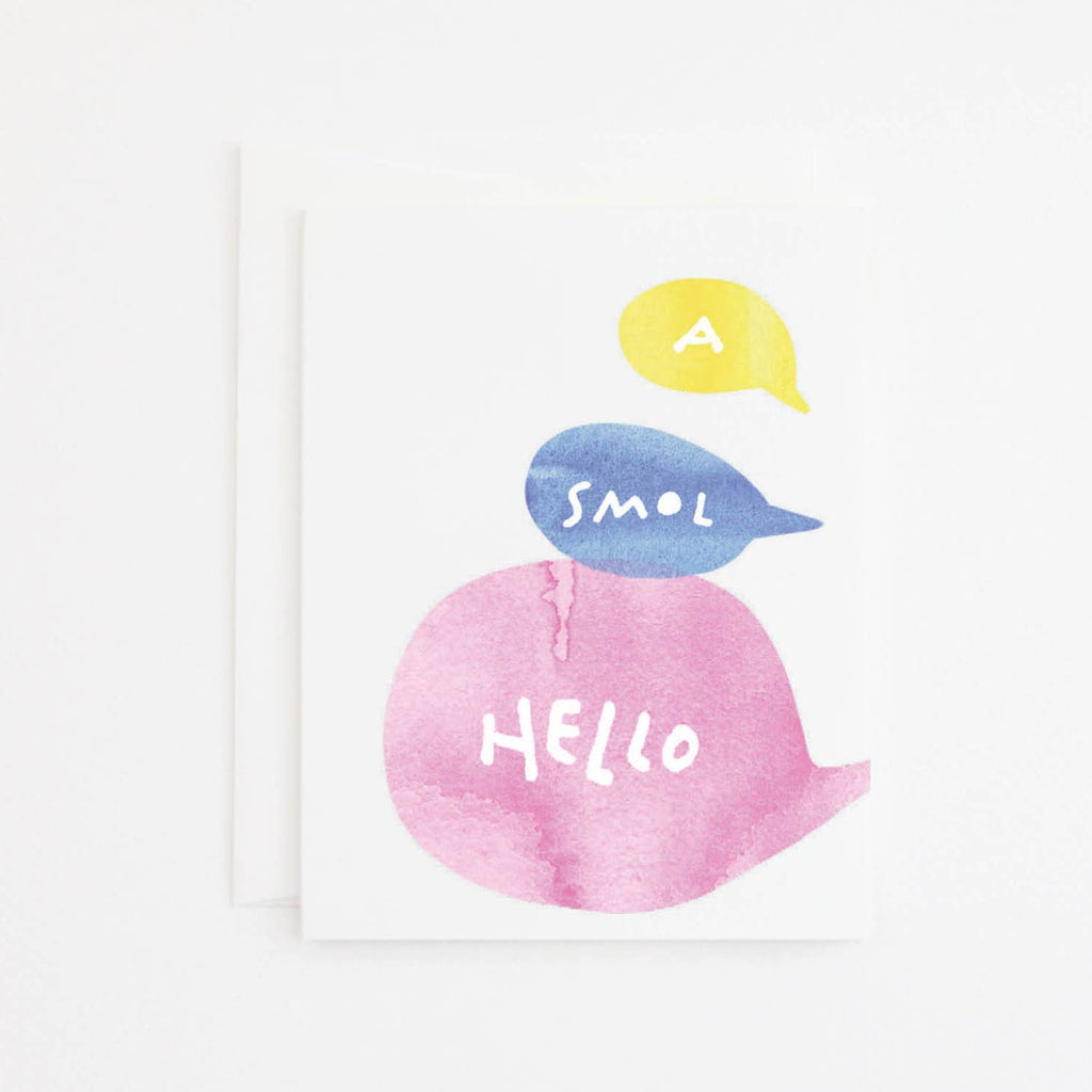 Greeting card with white background  and a yellow, blue and pink word bubble with white text says, "A Smol Hello". White envelope included, .