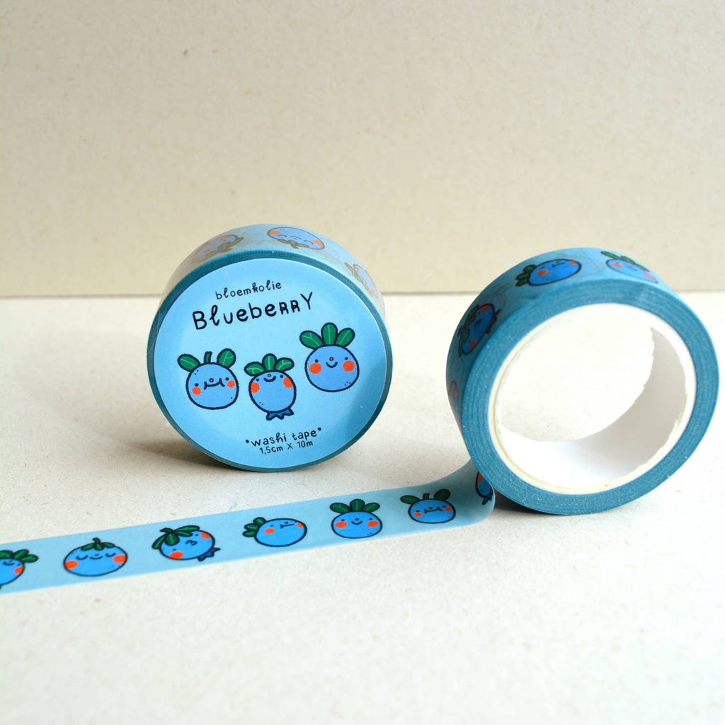 Image of roll of washi tape with light blue background and images of blueberries with green stems and red cheeks. 