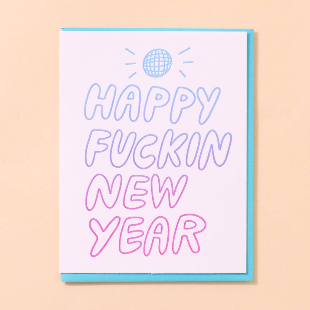Greeting card with white background and purple and pink outlined text says, "Happy Fuckin New Year" and disco ball above message. Envelope included.