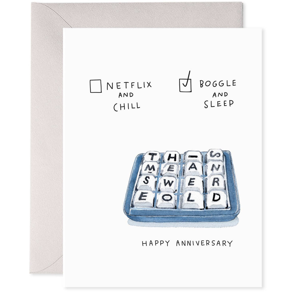 White background with image of blue and white boggle box with black letters says “THISMEANSWEAREOLD” and black text says, “Netflix and chill” with a checkbox and “Boggle and sleep” with a checkbox with a checkmark in it. “Happy anniversary”. Grey envelope is included. 