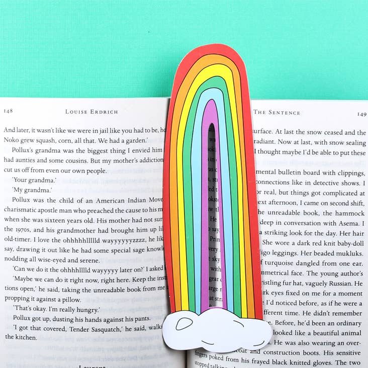 Image of book mark in shape of rainbow with white cloud at bottom. 