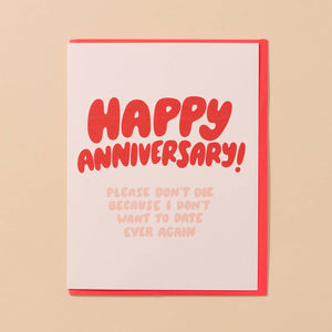 Greeting card with white background and red text says, "Happy Anniversary!" and pink text says, "Please don't die because I don't want to date ever again". Red envelope included. 